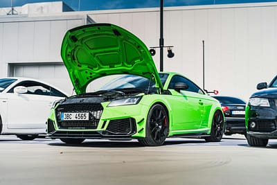 Audi TT RS with carbon-fibre front splitter and bonnet open, highlighting installation access and maintenance area