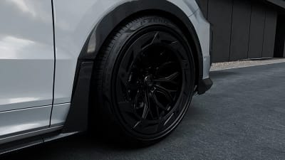 Close-up of forged wheel and carbon fibre arch detail on Porsche Cayenne Turbo GT