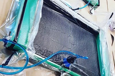 Carbon fibre manufacturing process showing precision layering and resin application – key to long-term durability and UV resistance